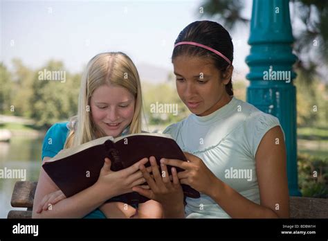 girls reading racially mixed ethnic diversity hispanic caucasian