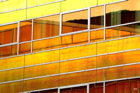 orange  yellow building  reflected   windows