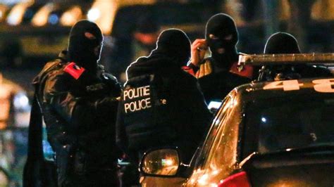 brussels lockdown belgian police arrest 16 in anti terror raids bbc news