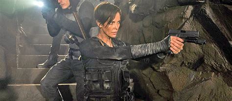 first look at charlize theron as immortal warrior in the