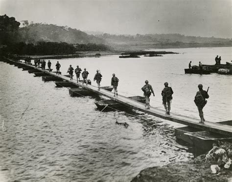 soldiers crossing river  floating pontoon bridge okinawa japan   digital