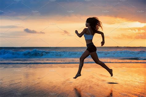 girl running  sunset beach sports recreation stock