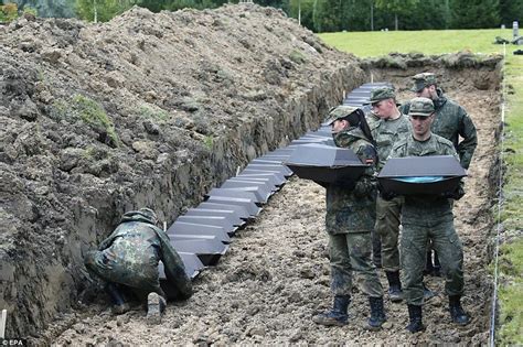 remains of 1 400 german wwii soldiers are re buried in russia projects to try german