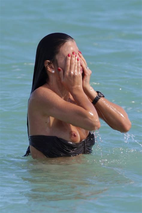 claudia galanti bikini double boob slip and nipple slip again and again in miami
