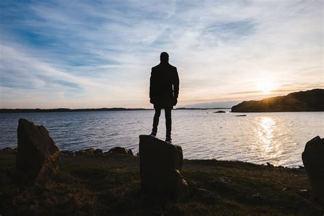 free images man beach sea coast nature rock ocean horizon silhouette person cloud