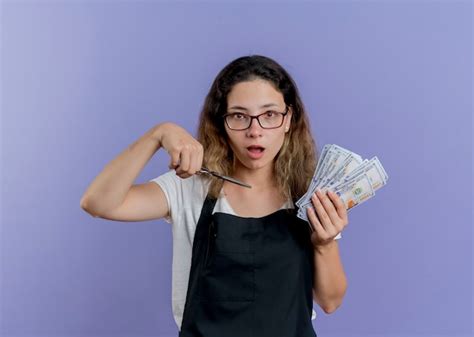 Free Photo Young Professional Hairdresser Woman In Apron Holding