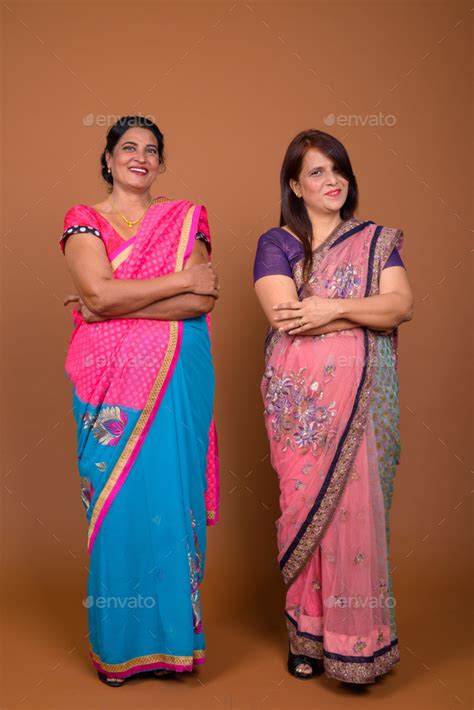 two mature indian women wearing sari indian traditional clothes stock