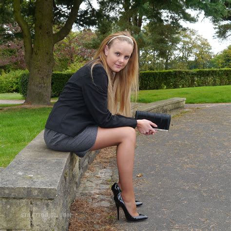 cute blonde is outdoors in tall black high heel shoes and sexy n pichunter