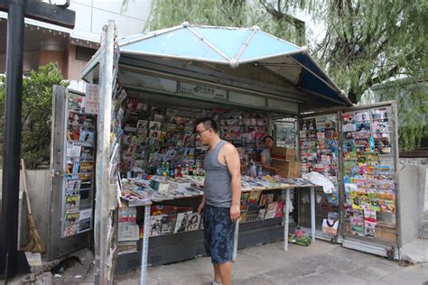 this newspaper stand located in northern beijing will be demolished soon the owner of the booth