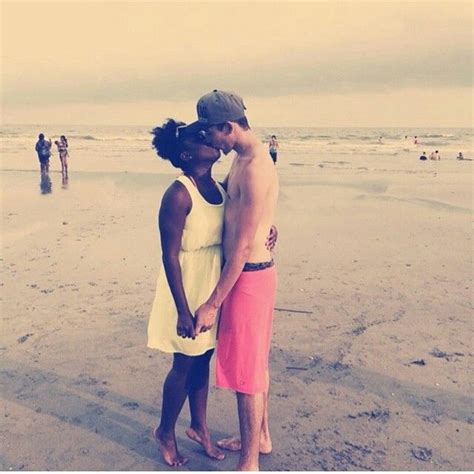 beautiful interracial couple kissing on the beach love wmbw bwwm