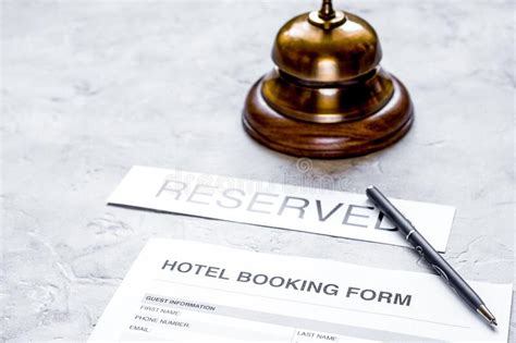 booking form  hotel room reservation   ring stone background stock photo image