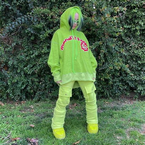 billie eilish wearing neon green hoodie  neon green sweatpantswhat stars   stars