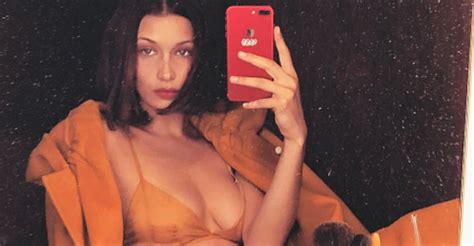 bella hadid struck a hand bra pose while wearing a thong combining two