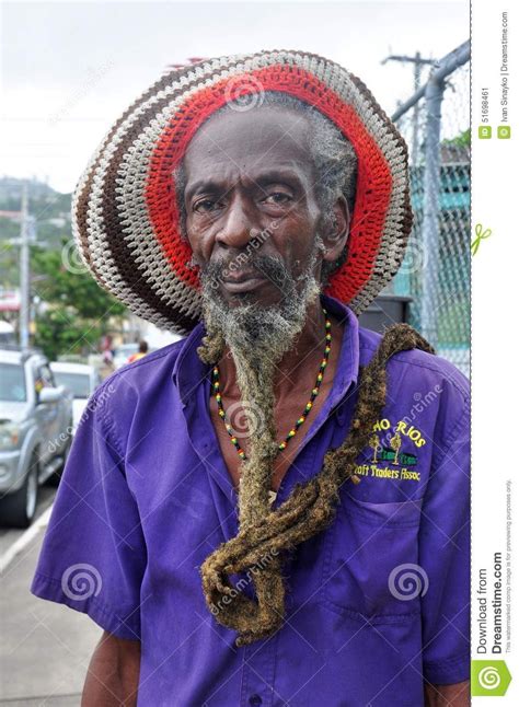 photo about rastafarian man face with very long beard and dreadlocks