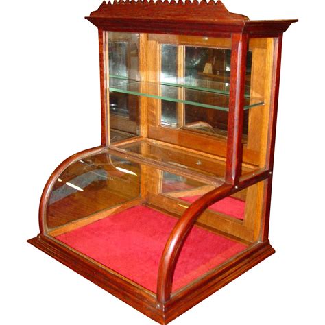 Neat Small Oak Curved Glass Counter Display Case From