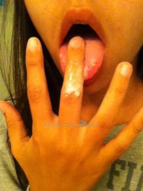 asian teen licking her cum from fingers