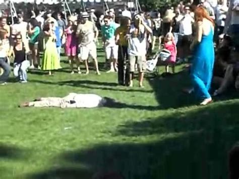 drunk girl does the worm on street as her dress flies up jukin media inc