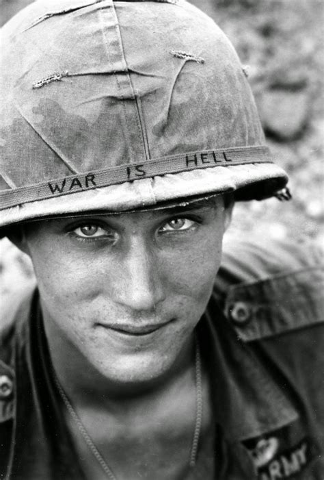 american soldier wears  hand lettered war  hell slogan   helmet vietnam
