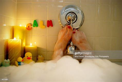 Woman Relaxing In A Bubble Bath Photo Getty Images