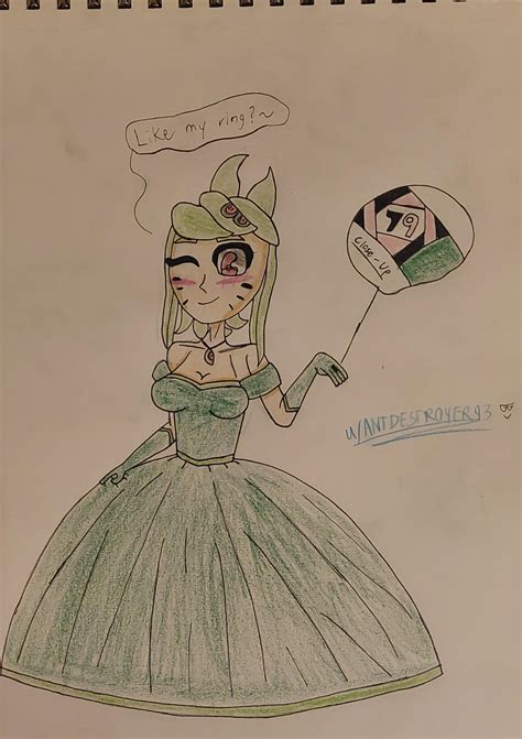 Melony Showing Off Her Ring While Wearing A Green Ball Gown Of
