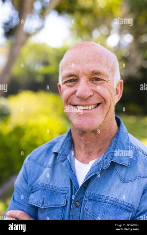Vertical Portrait Of Senior Caucasian Men Wearing Blue Shirt And