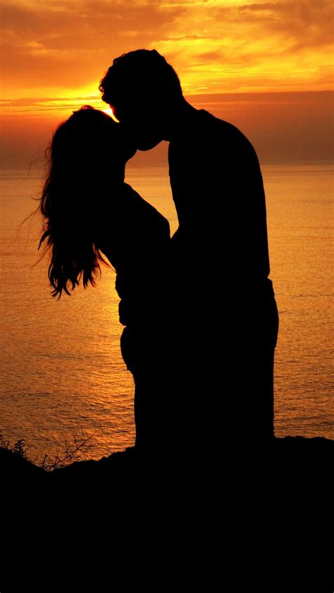 Download Wallpaper 1080x1920 Silhouettes Kiss Couple