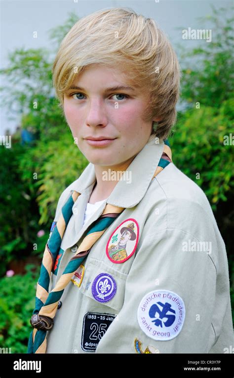 boy  wearing  scouts uniform  badges neckerchief
