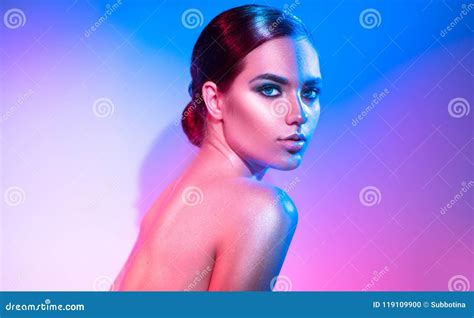 High Fashion Model Girl In Colorful Bright Sparkles And Neon Lights