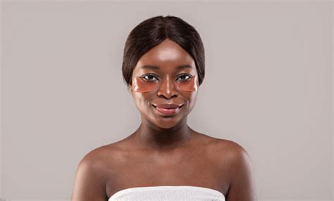 closeup of beautiful african female with undereye brightening hydrogel