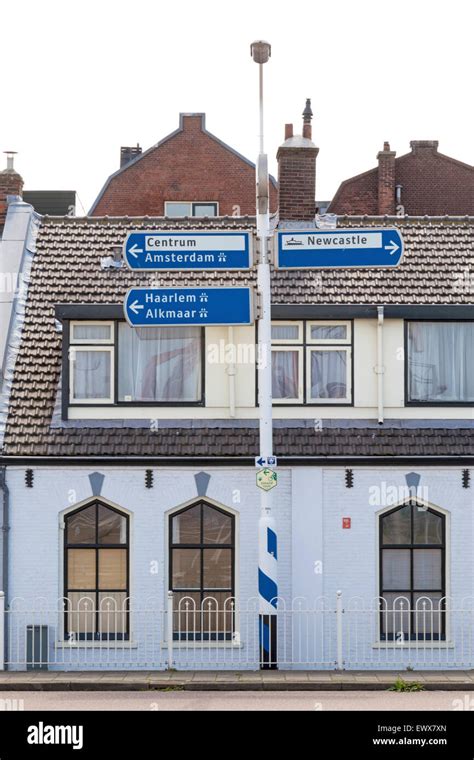 anwb signpost indicating  directions   newcastle ferry  alkmaar amsterdam