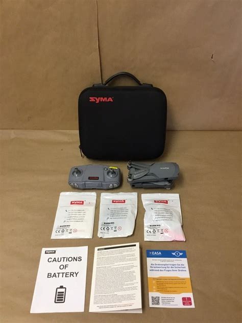 original syma  foldable  drone   batteries charger  case  rs  gujarat