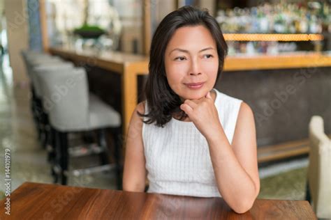 elegant asian middle aged businesswoman pensive portrait beautiful