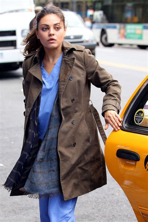 mila kunis wears hospital scrubs and a stained coat as she films scenes for the angriest man in
