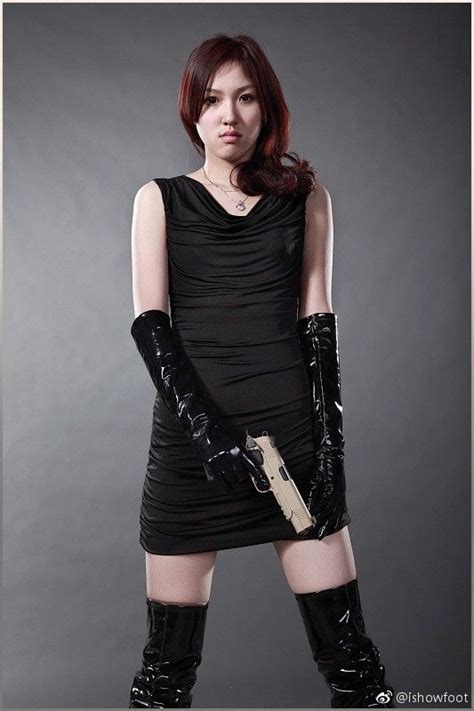 Asian Girl In Minidress Gloves Thigh Boots With Pistol Bow Boots Black