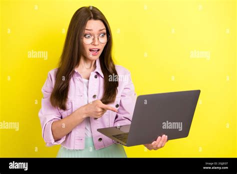 Portrait Of Attractive Nervous Desperate Girl Using Laptop Pointing At