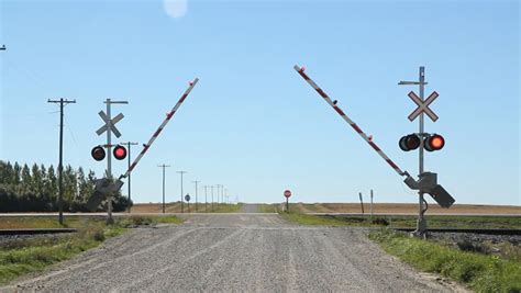 rail crossing  sound  train coming gates lowering rail crossing