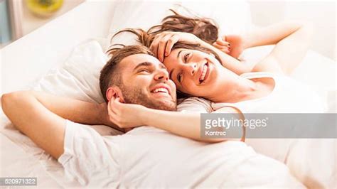 Two People Kissing In Bed Photos And Premium High Res Pictures Getty