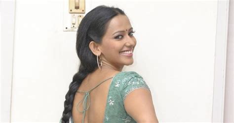 super spicy tamil actress sanjana singh in a bare back saree looking hot stills