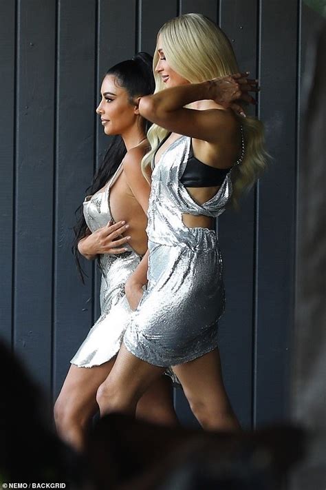 kim kardashian flashes plenty of side boob as she makes cameo in paris hilton s music video