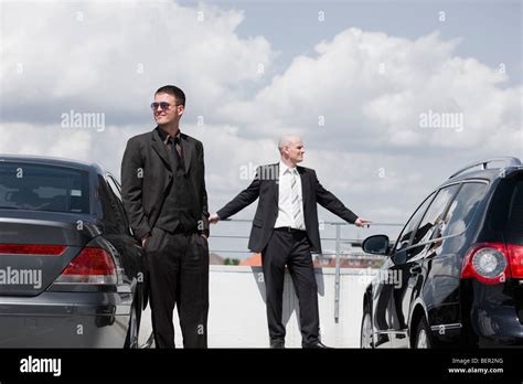 business men standing  cars stock photo alamy