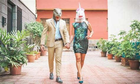 Crazy Senior Couple Wearing Chicken And T Rex Mask While