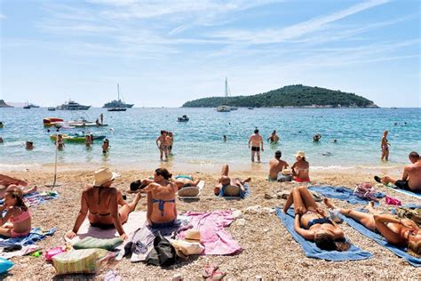 people sunbathing  beach  adriatic sea dubrovnik editorial photography image  european