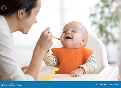 baby feeding bottle   milk   top   sofa stock image cartoondealercom