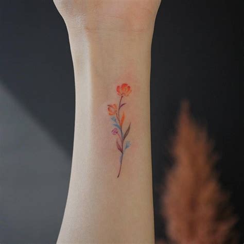 Small Watercolor Flower Tattoo On The Inner Wrist Tiny Flower Tattoos
