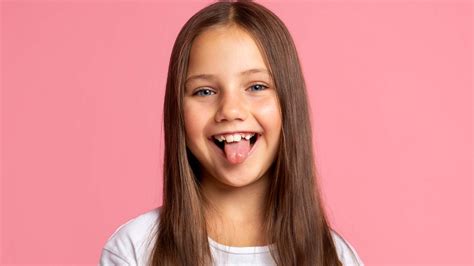 happy young girl sticking   tongue lippitz orthodontics