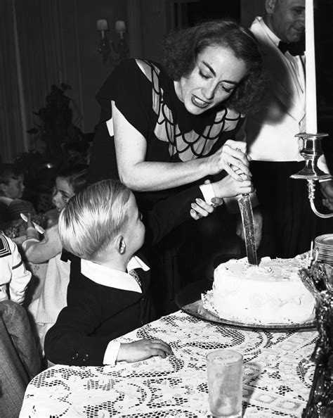 joan crawford helping son cut birthday cake actors actre flickr