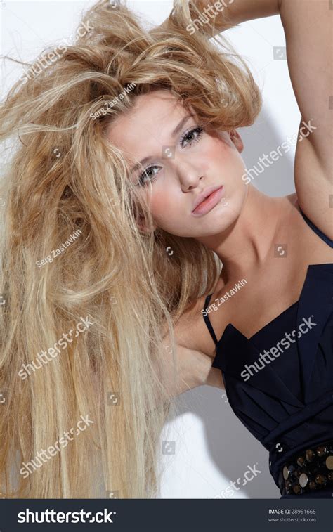 Portrait Of Beautiful European Blonde Model Showing Her