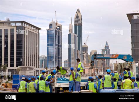 immigrant foreign construction workers building dubai   dubai stock photo royalty