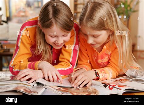 young girls read magazines stock photo alamy