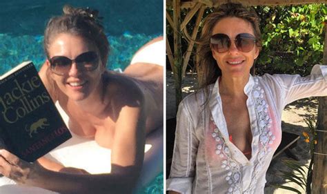 elizabeth hurley sunbathes topless and can t resist